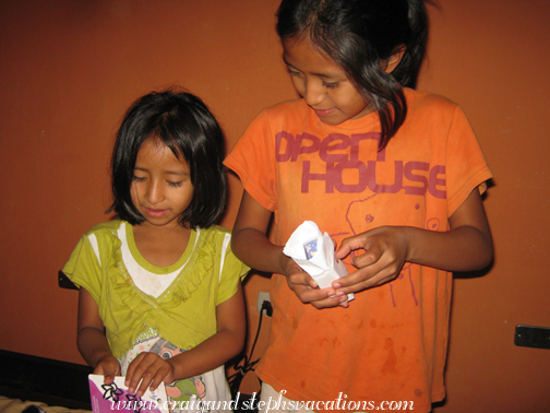 Aracely helps Yoselin open her presents Aracely helps Yoselin open her presents