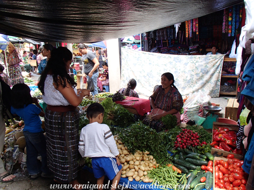 Buying vegetables at the market Buying vegetables at the market