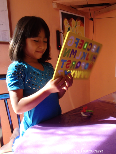 Aracely with the alphabet puzzle Aracely with the alphabet puzzle