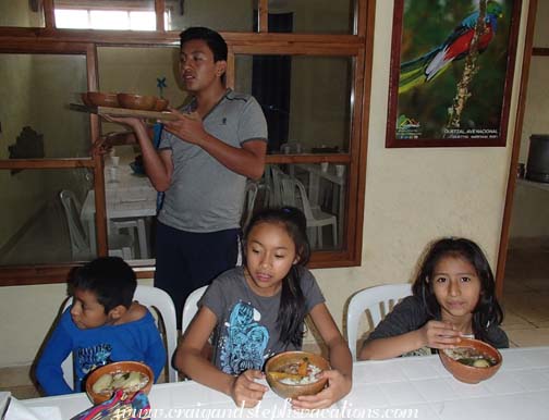 Junior serves the kids lunch Junior serves the kids lunch