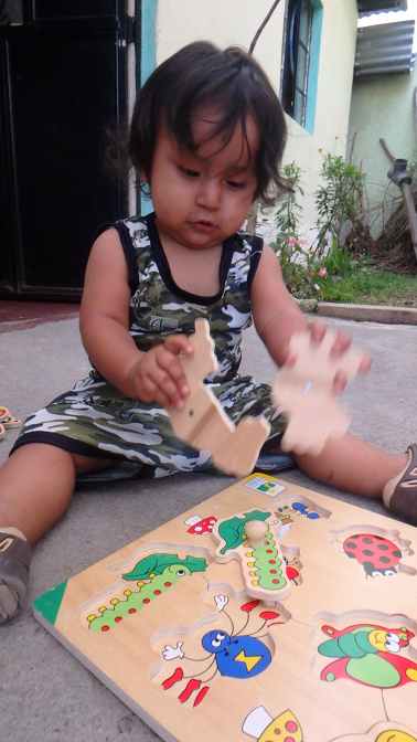 Ian Ivan plays with a puzzle