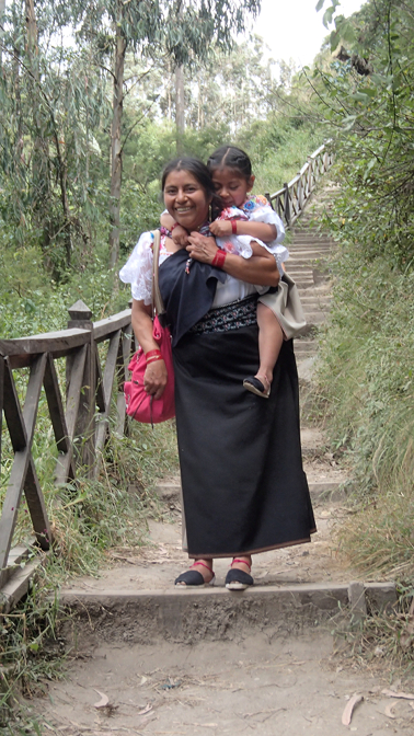 Rosa carries Shina at Peguche Falls