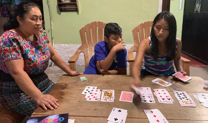 Aracely playing solitaire