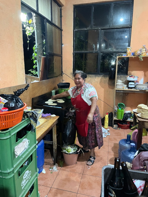 Isabela cooking in her restaurant