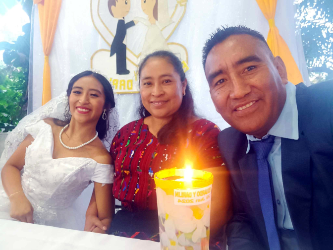 Aracely, Paulina, and Humberto at the head table