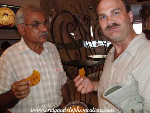 Enjoying masala crackers at LMB Sweet Shop