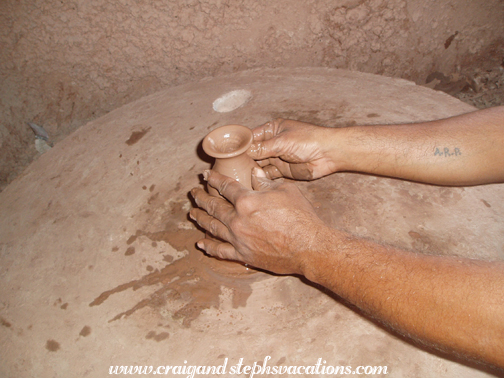 Mr. Achlaram spins a terra cotta pot