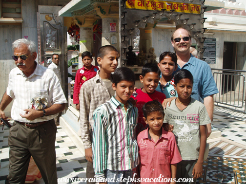 Boys pose with Craig at Charbhurja shrine