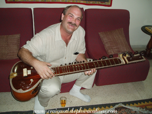 Craig holds Jagdish Ji's sitar