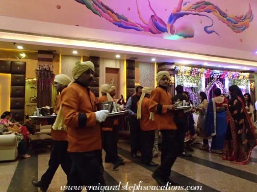 Servers circulate appetizers Servers circulate appetizers