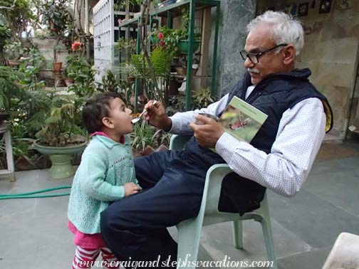 Mukul feeds Sara some pomagranate while we watch the birds Mukul feeds Sara some pomagranate while we watch the birds