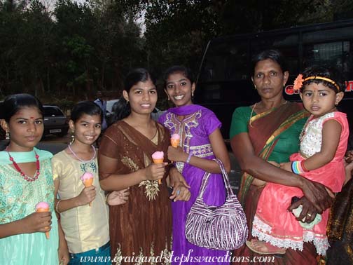 A family enjoying ice cream after the festival A family enjoying ice cream after the festival