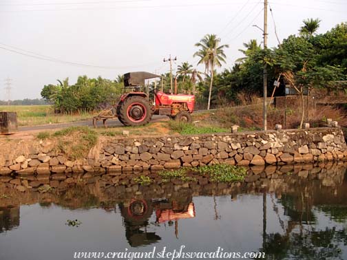 Tractor reflected in the canal Tractor reflected in the canal