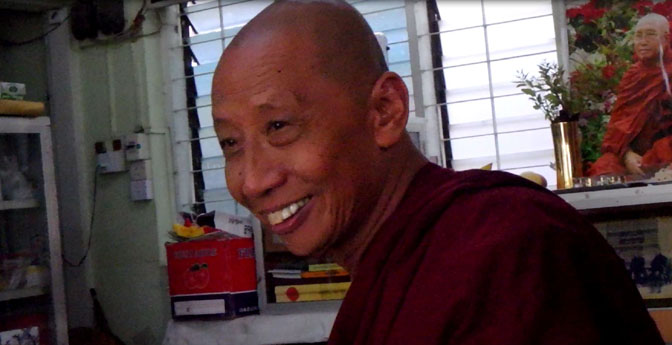 Dharamsala the monk greets us at Chanmyay Yeiktha Meditation Centre