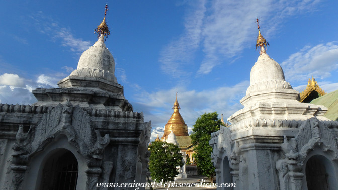 Maha Lawka Marazein Stupa gleams in the sunlight between whitewashed pagodas Maha Lawka Marazein Stupa gleams in the sunlight between whitewashed pagodas
