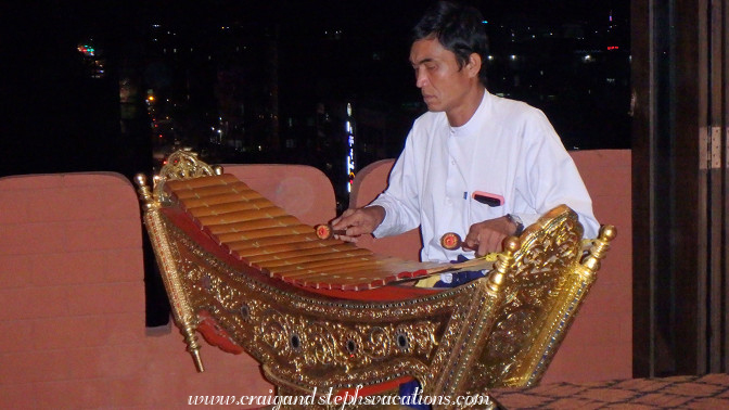 Man plays a pattala (Burmese bamboo xylophone) at Shwe Bagan Restaurant Man plays a pattala (Burmese bamboo xylophone) at Shwe Bagan Restaurant