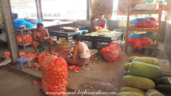 Volunteers prepare food for the monks at Mahagandayon Monastery