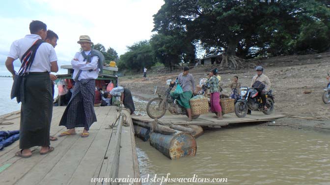 People on scooters and motorbikes start to board our ferry
