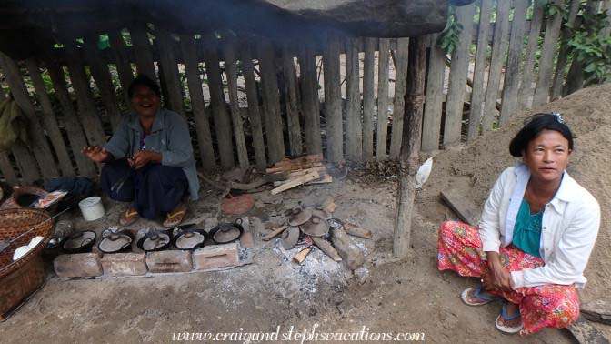 A woman cooks Burmese pancakes
