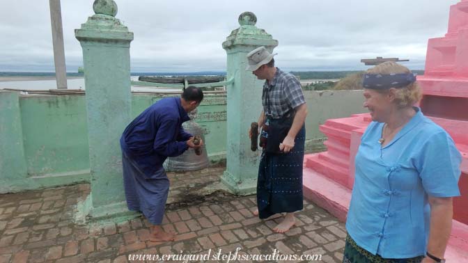 Craig learns the proper technique for ringing the bell at Kanee monastery