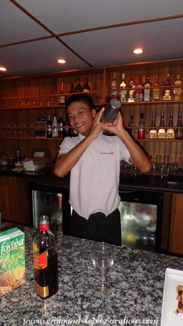 Htet prepares rum punch for happy hour