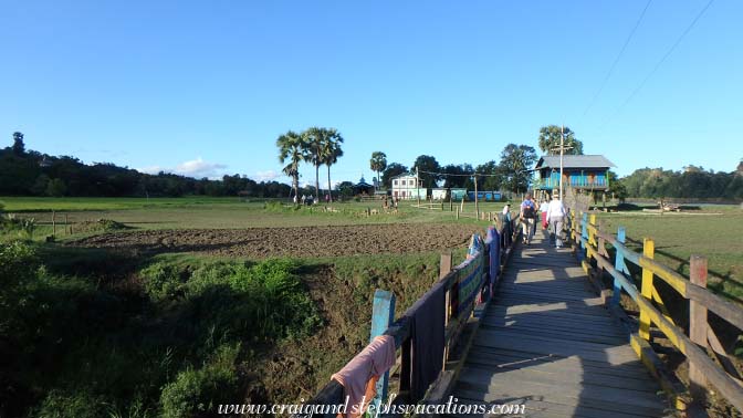 Walking down the boardwalk toward the monastery, Kaung Tee Village