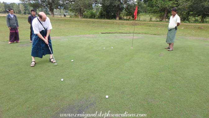 Craig putts at the 18th hole of Maw Laik Craig putts at the 18th hole of Maw Laik