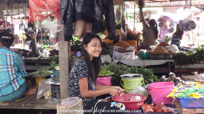 Young woman selling food at the market Young woman selling food at the market