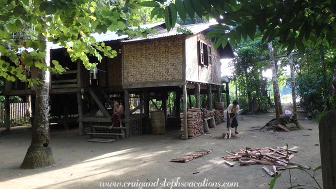 Man splitting wood, Shwe Lat Pan Village Man splitting wood, Shwe Lat Pan Village