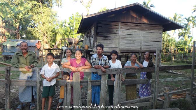 Neighbors come over to see what all the fuss is about,Tha Phan Seit Village