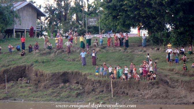 Villagers wave as we sail up the Chindwin away from Tha Phan Seit Village