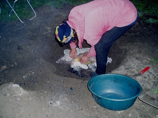 Stan digging up the hangi Stan digging up the hangi